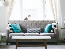 brown and white wooden table beside sofa chair
