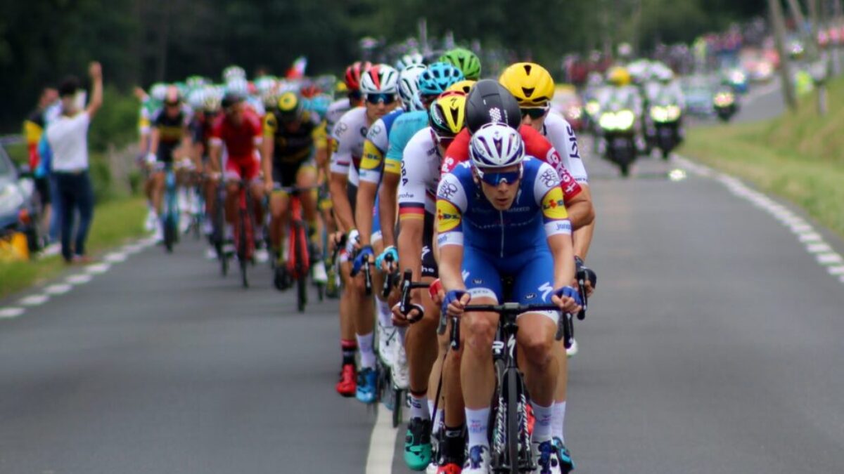 group of cyclists marching on highway