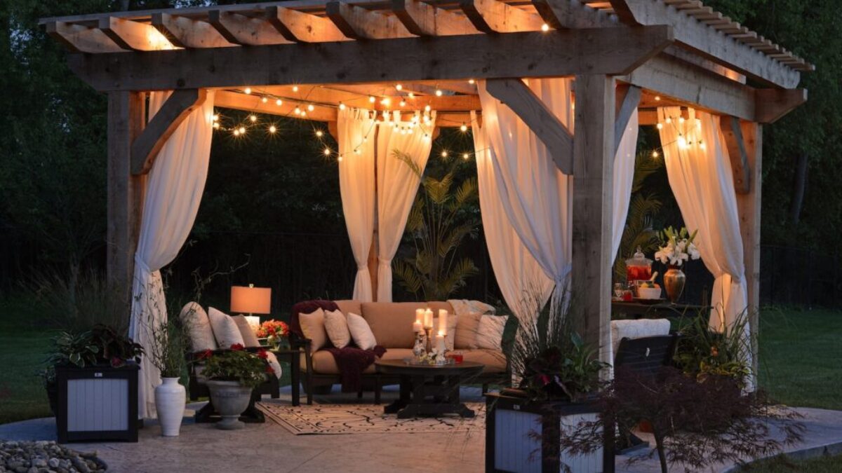 photo of gazebo with curtain and string lights