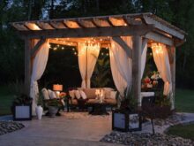 photo of gazebo with curtain and string lights