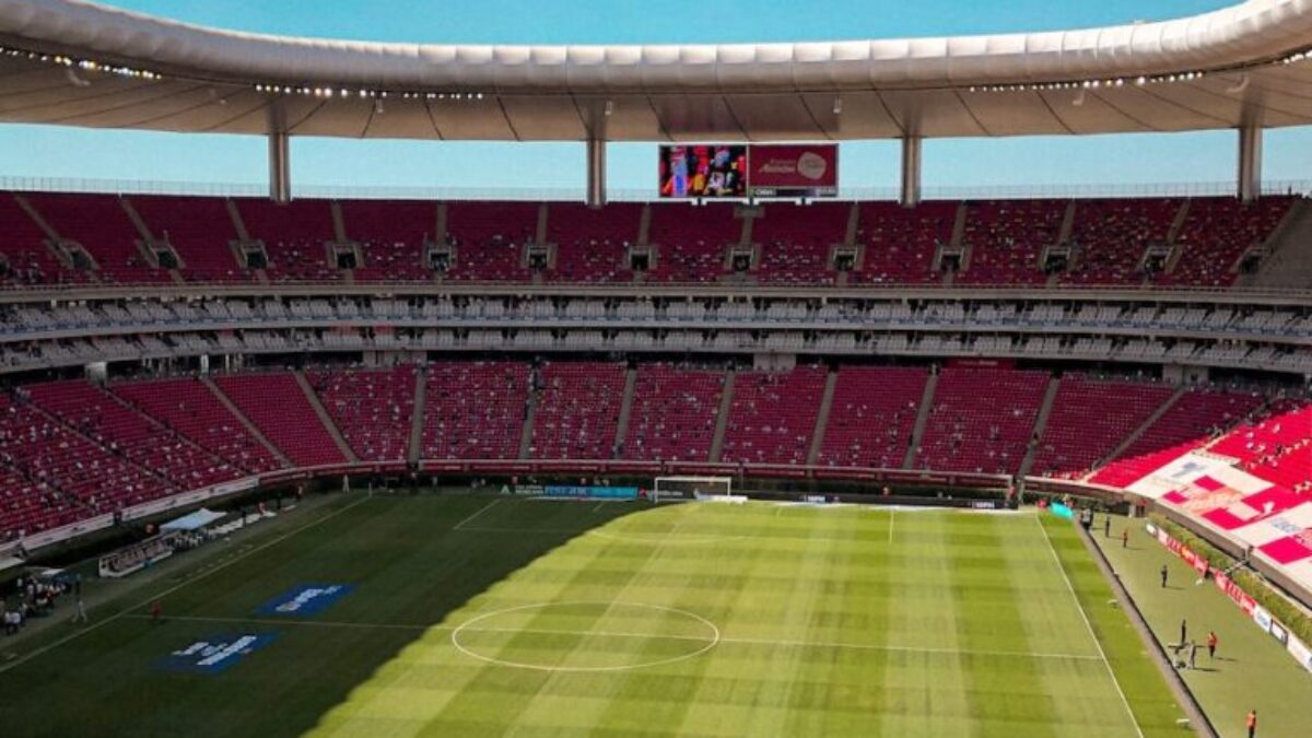 green and brown football stadium under blue sky during daytime