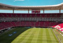 green and brown football stadium under blue sky during daytime