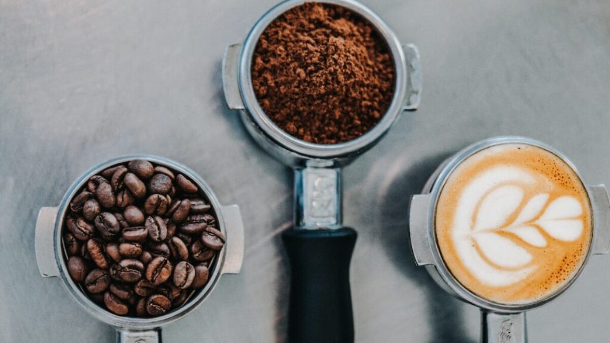 flat lay photography of coffee latte, ground coffee, and coffee beans