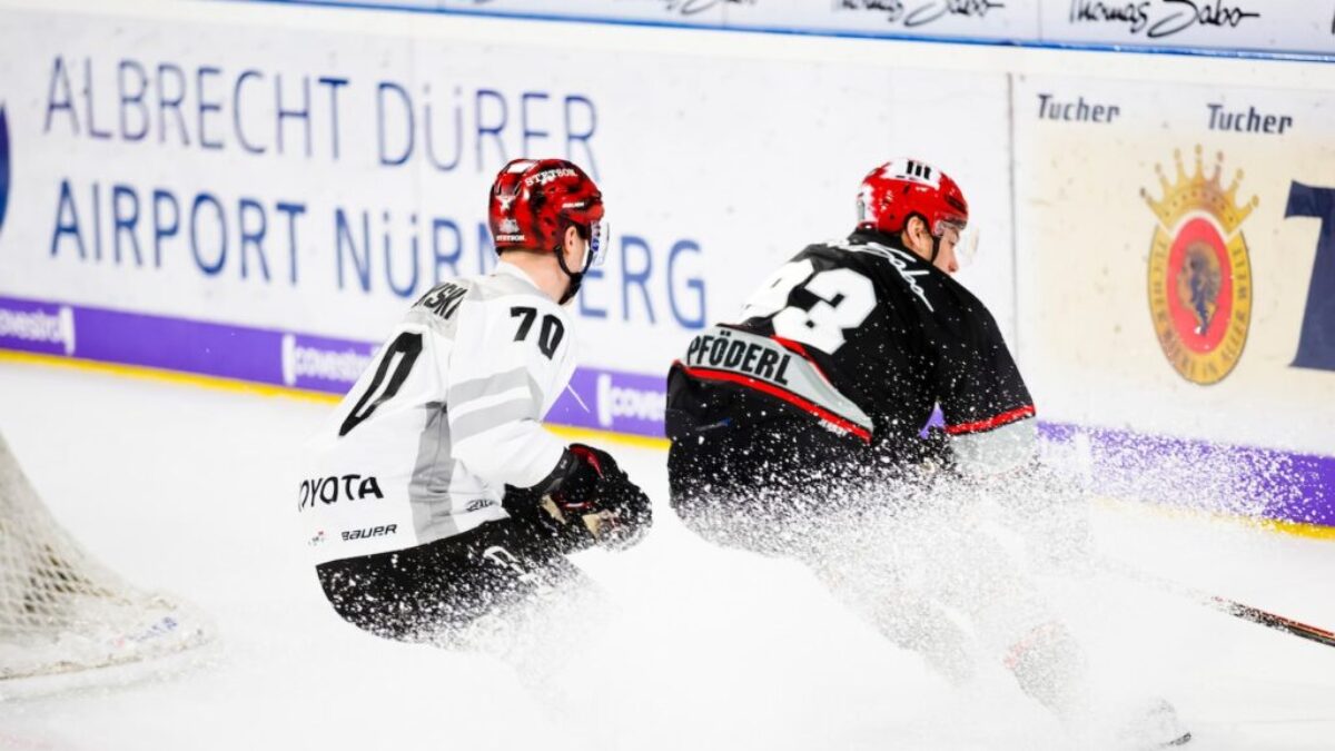 two hockey players in hockey stadium