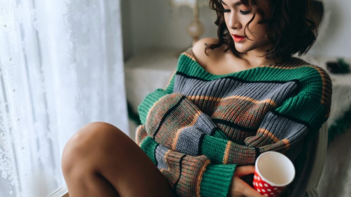 a woman sitting on a couch