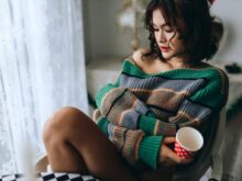 a woman sitting on a couch