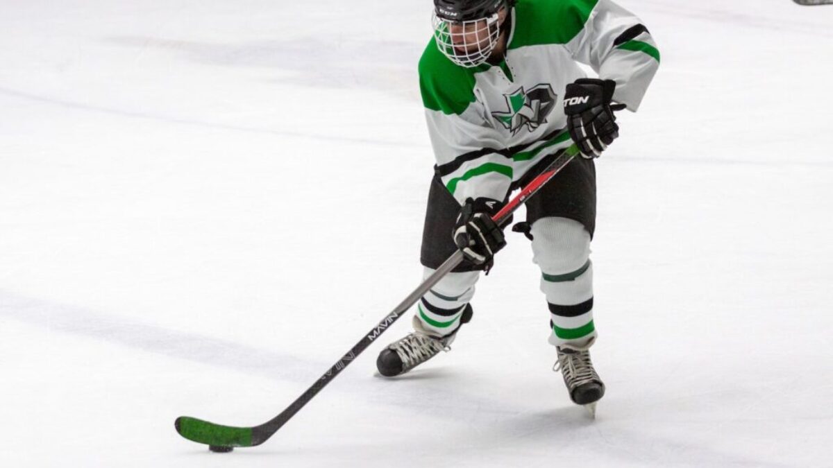 man in yellow and green ice hockey jersey t