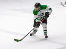 man in yellow and green ice hockey jersey t