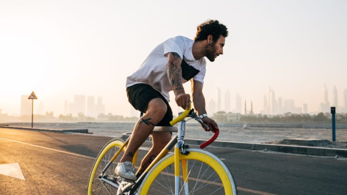 man riding bicycle on road during daytime