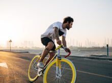 man riding bicycle on road during daytime