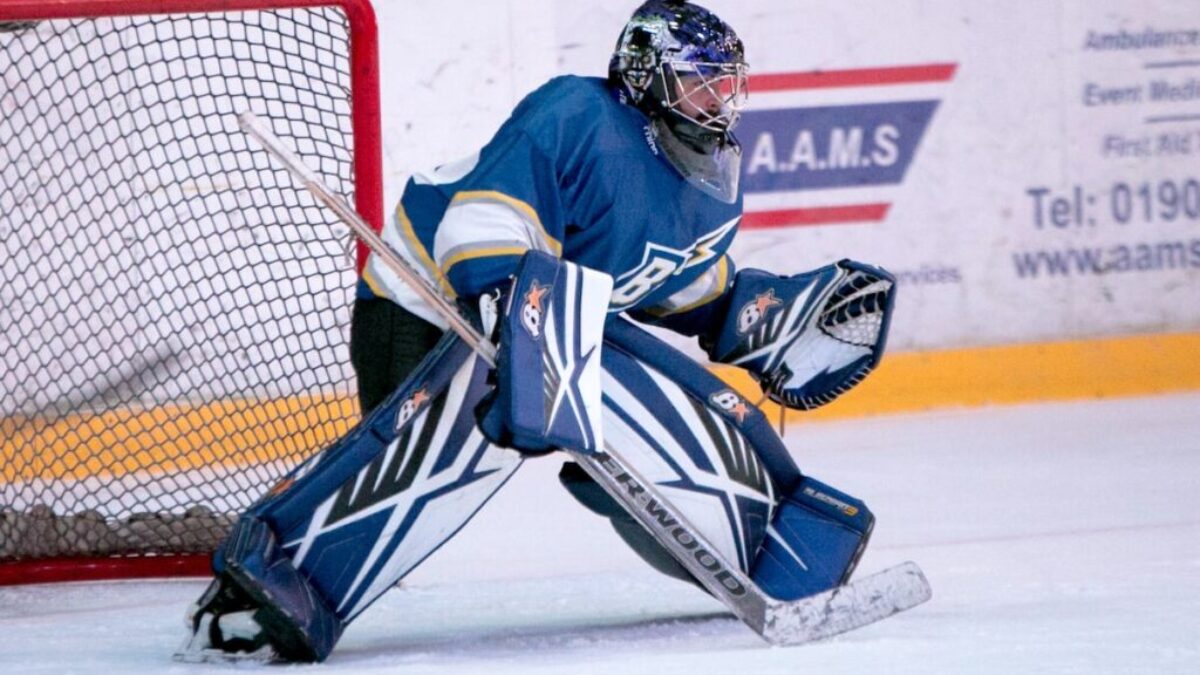 ice hockey goalie defending the goal