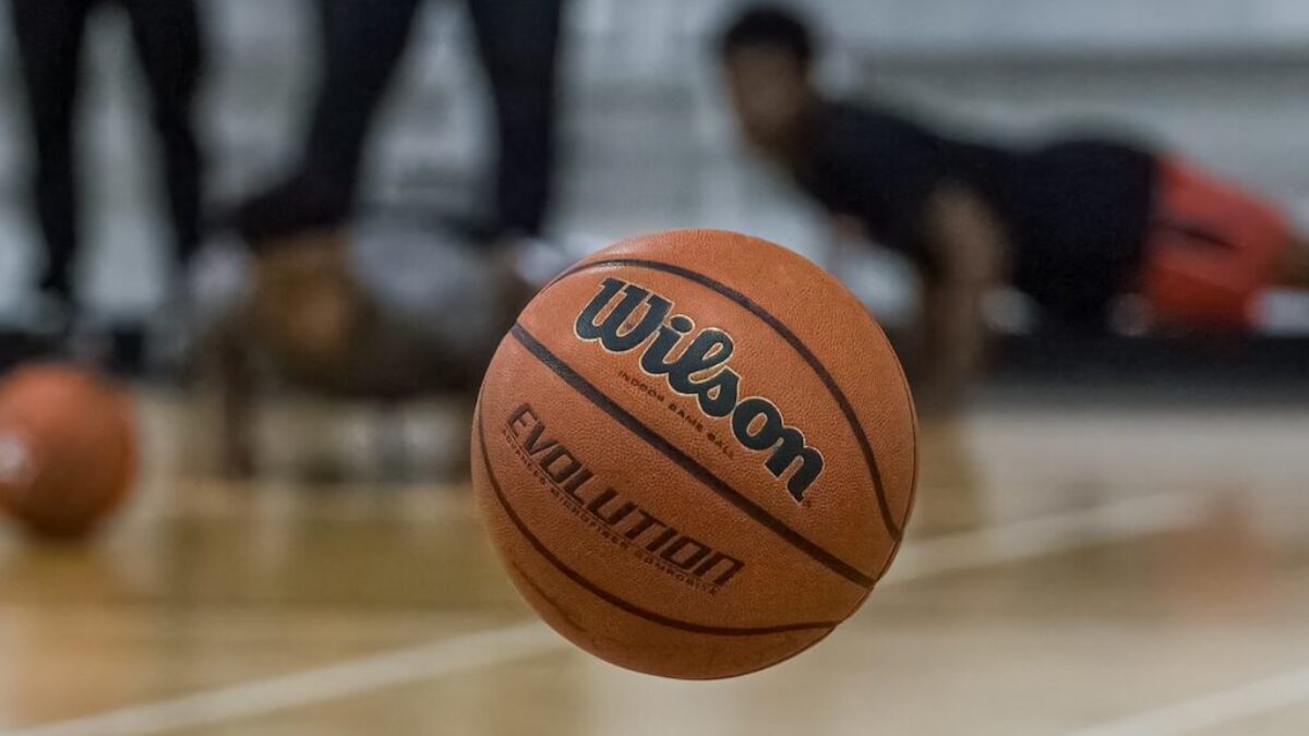 a basketball sitting on top of a basketball court