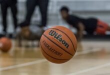 a basketball sitting on top of a basketball court