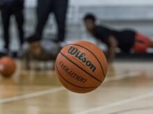 a basketball sitting on top of a basketball court