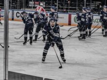 ice hockey players on ice hockey field