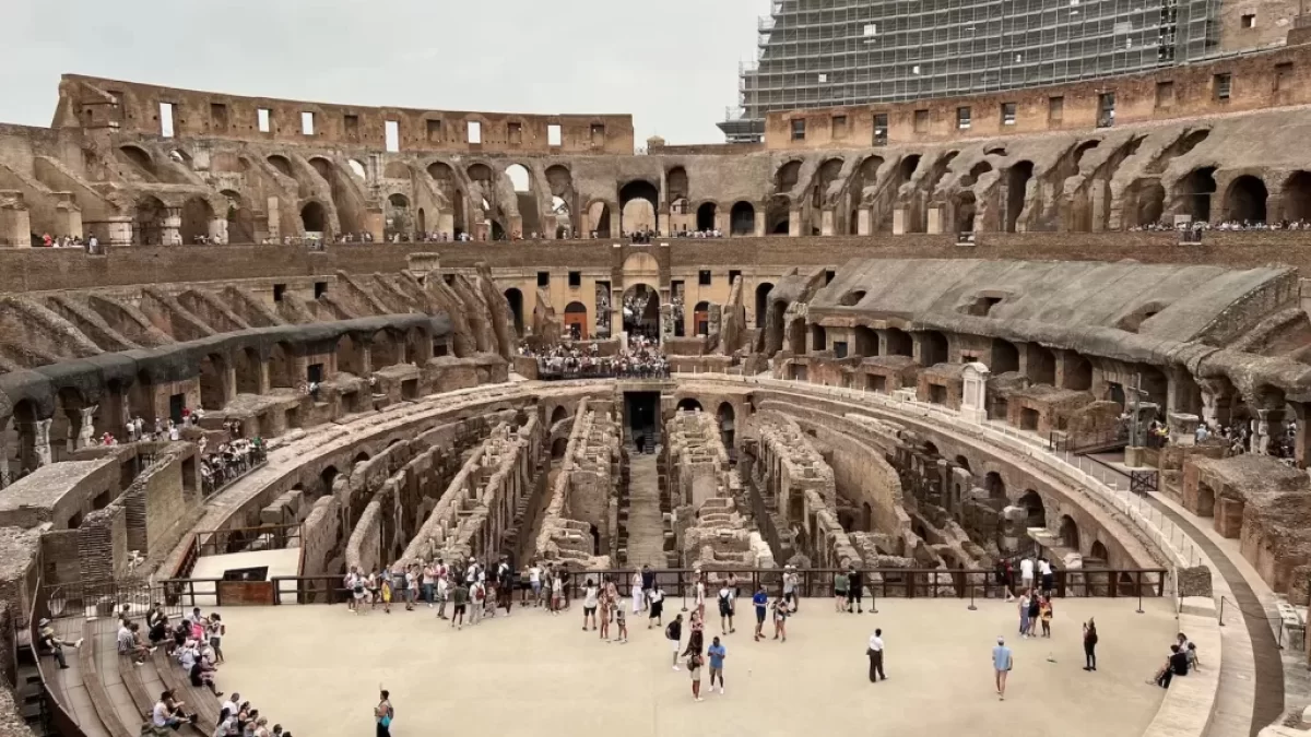 a group of people standing inside of a stone building