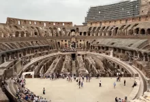 a group of people standing inside of a stone building