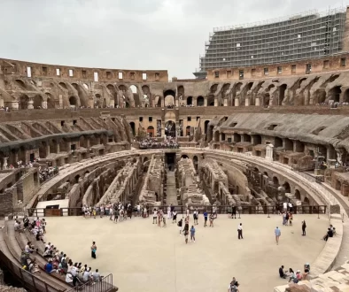 a group of people standing inside of a stone building