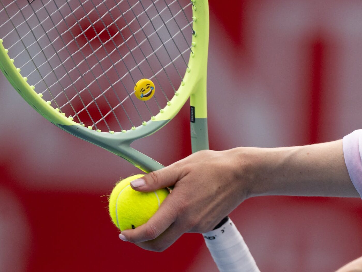 Woman Hands Holding Tennis Ball and Racket with Emoji
