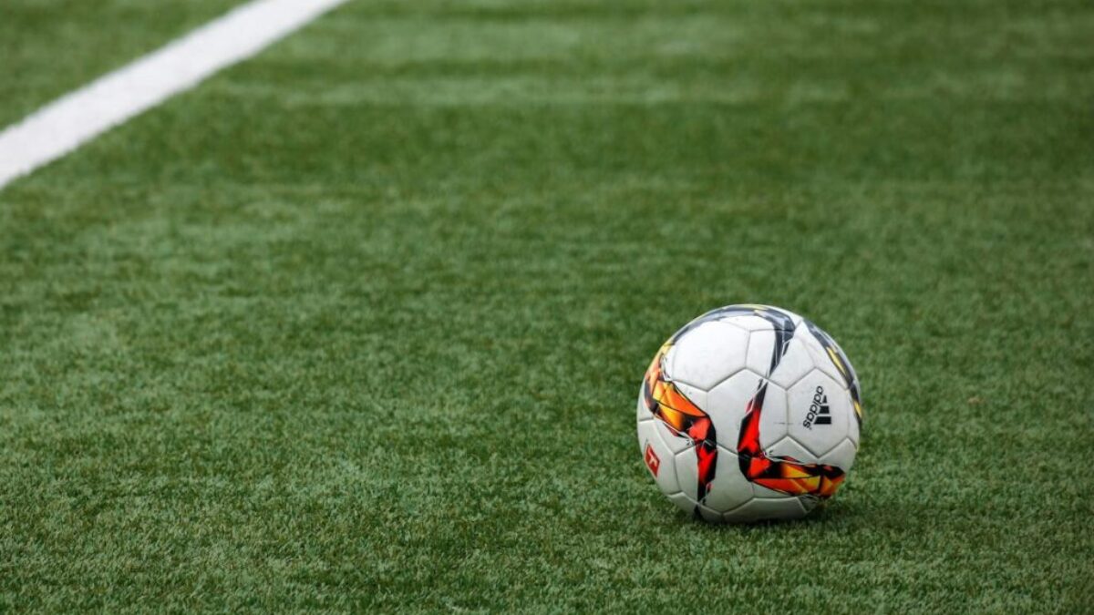White Adidas Soccer Ball on Grass