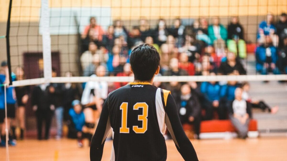 man wearing black 13 volleyball jersey