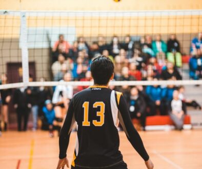 man wearing black 13 volleyball jersey
