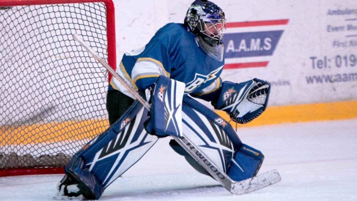 ice hockey goalie defending the goal
