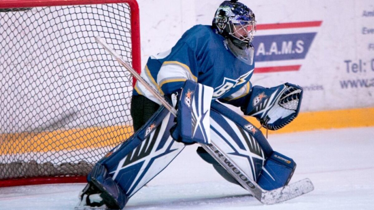 ice hockey goalie defending the goal