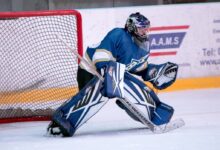 ice hockey goalie defending the goal
