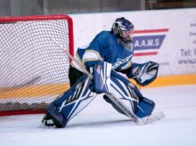 ice hockey goalie defending the goal