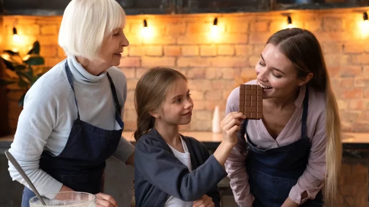 Tři ženy, které ochutnávají čokoládu.