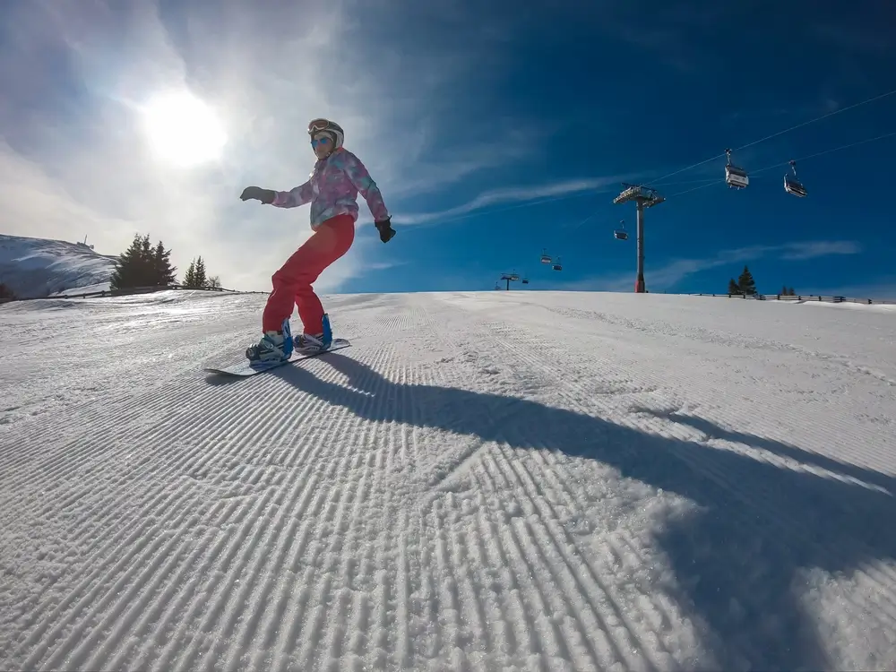 - SportDeník Žena na snowboardu