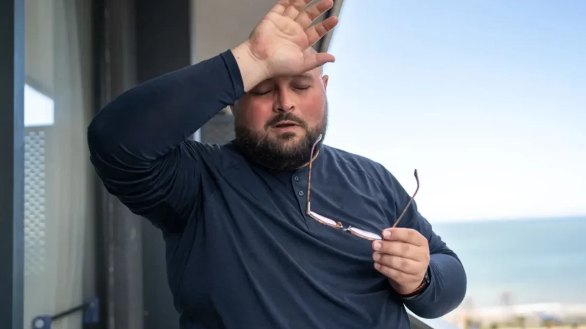 zpocený muž